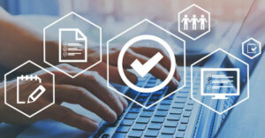 computer keyboard with hands typing on the keys