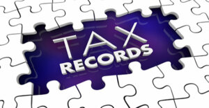 puzzle outline with the words "tax records" in the middle