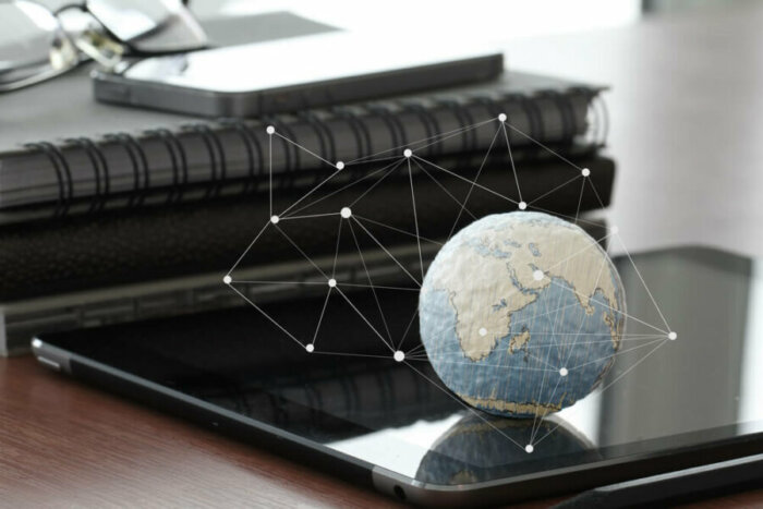 Hand Drawn Texture Globe With Blank Social Media Diagram On Digital Tablet Computer As Internet Concept And Bokeh Exposure