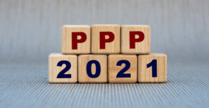 blocks on a table with that spell out PPP 2021