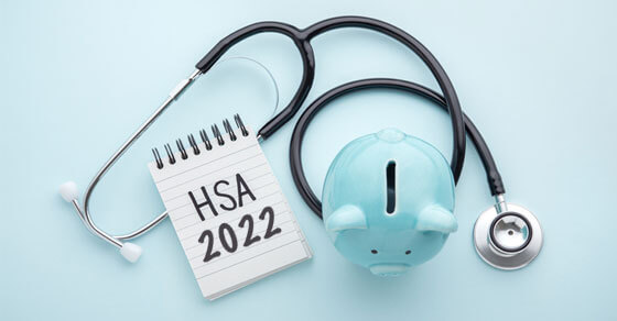 image of a blue piggy bank, stethoscope, and pad with "HSA 2022" written on it.