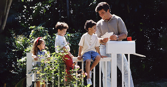 picture of a family - a father and three young children