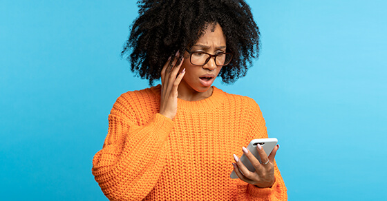 image of an individual looking at their phone