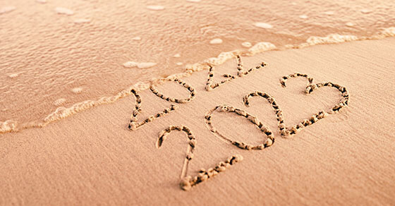 New Year 2023 replace 2022 on the sea beach summer. New Year 2023 is coming concept.