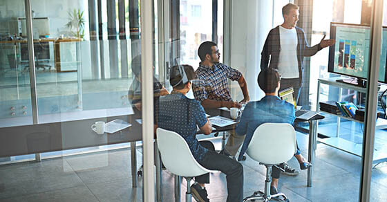 Shot of a young businessman giving a presentation in the boardroom