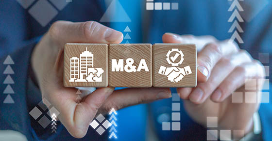 Merger and Acquisition Business Corporate Cooperation Company concept. MA partnership concept on wooden dices in businessman's hands.