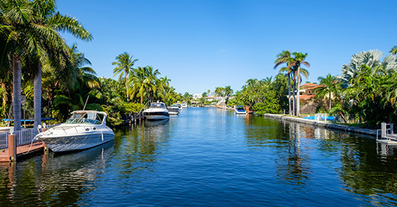 Image of a crystal blue lake and boats