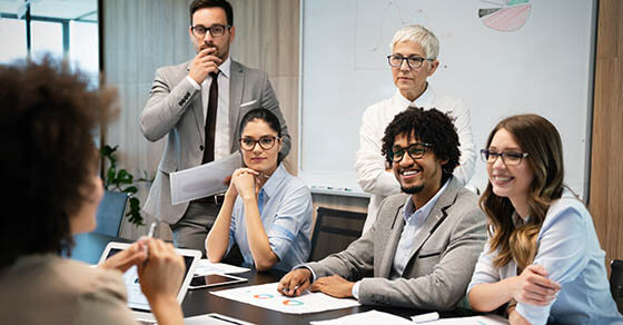 Group of business people working together, brainstorming in office