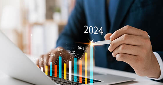 Businessman analyzes profitability of working companies with digital augmented reality graphics, positive indicators in 2024, businessman calculates financial data for long-term investments.