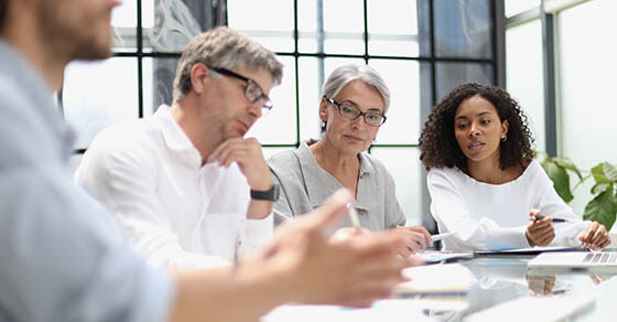 discussion of business people in the office sitting at the table