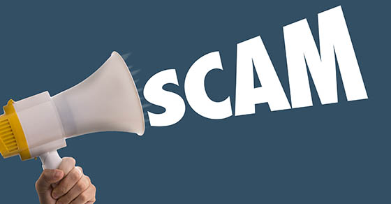 blowhorn with the word "scam" coming out of it.