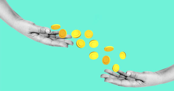 image of coins being passed from one hand to another.