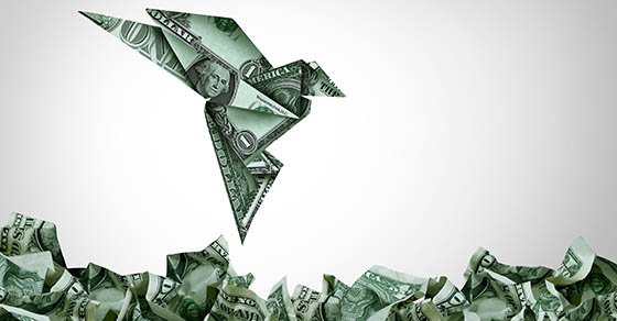 Smart money and US currency or cash as a financial ideas as an American currency shaped as an origami flying upward as an economic growth symbol of investing success and USA dollar strength.