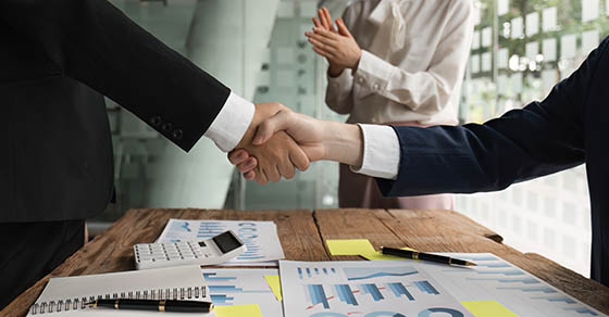 Business people shaking hands, finishing up meeting. business merger and acquisition concept