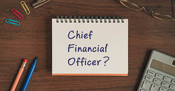 There is notebook with the word Chief Financial Officer. It is as an eye-catching image.
