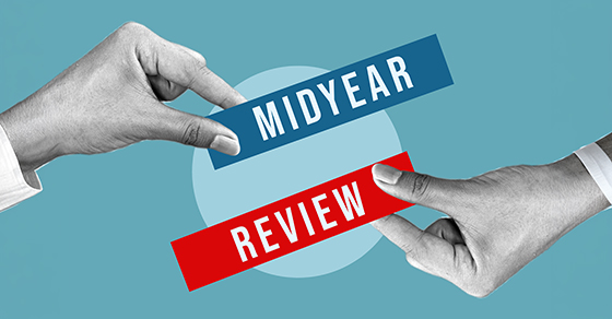 image of to signs, one that says "MIDYEAR" and the other that says "REVIEW"