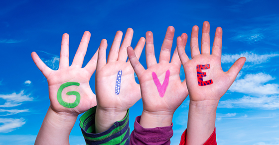 image of hands with the letters GIVE on them